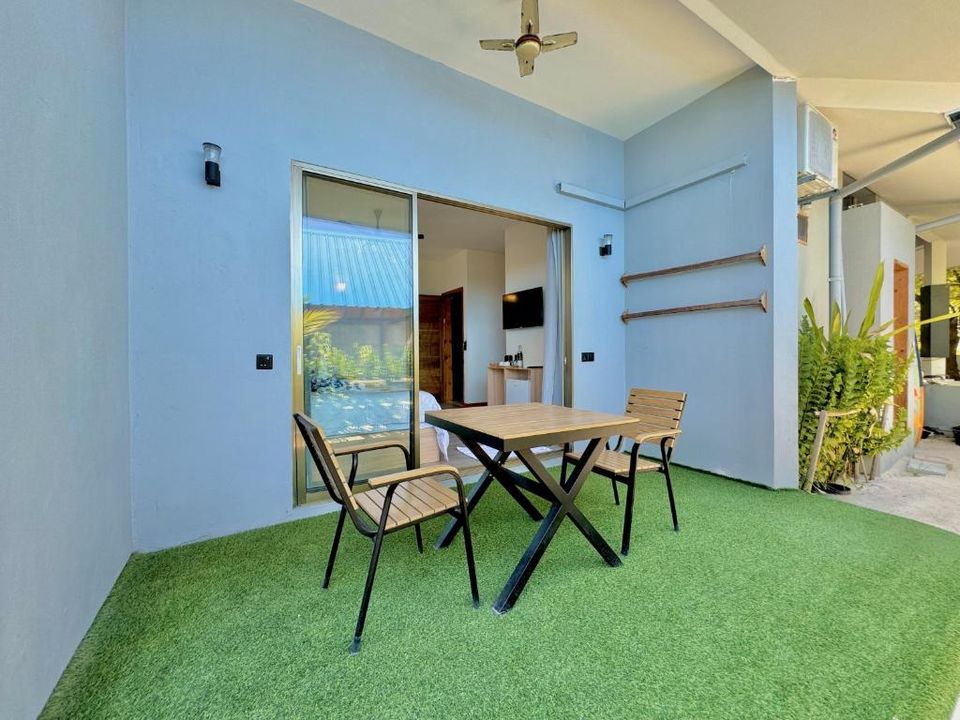 Family villa private terrace with garden table